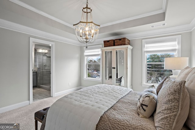 bedroom with carpet floors, a raised ceiling, visible vents, and multiple windows