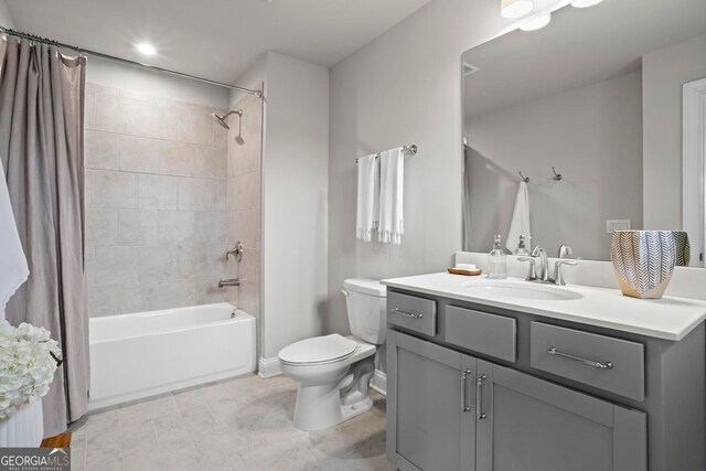 bathroom featuring vanity, toilet, and shower / bathtub combination with curtain