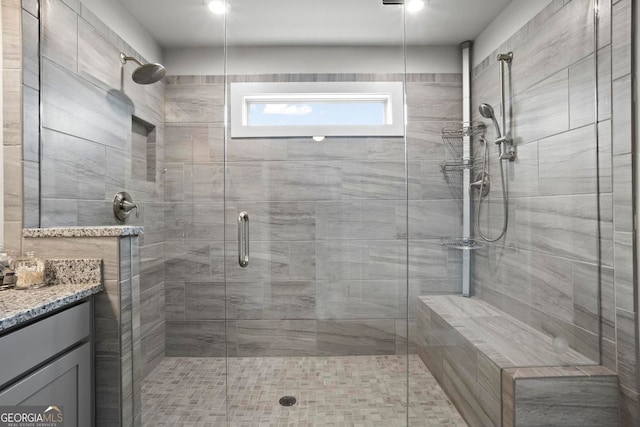 full bath with a sauna, a shower stall, and vanity