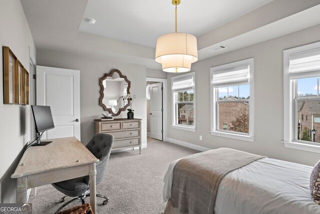 bedroom with baseboards, multiple windows, visible vents, and light colored carpet