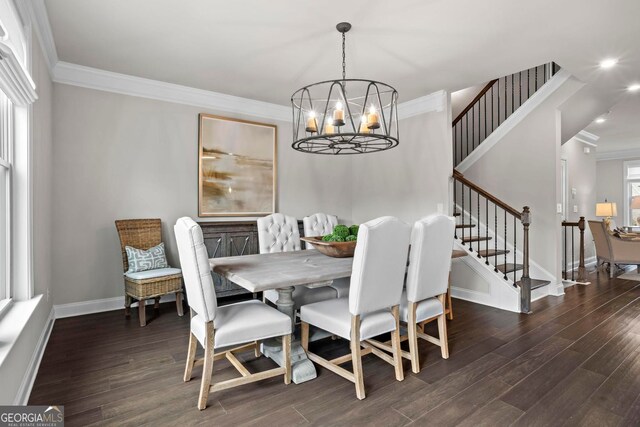 dining space featuring ornamental molding, stairway, and wood finished floors