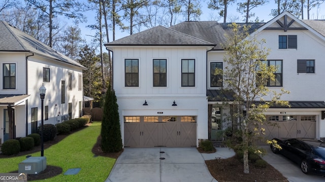 view of front of property with brick siding, a shingled roof, concrete driveway, an attached garage, and board and batten siding