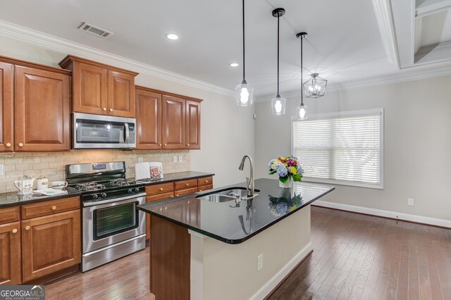 2275 W Village Ln SE, Smyrna, GA 30080 - kitchen featuring a sink, baseboards, brown cabinetry, and stainless steel appliances