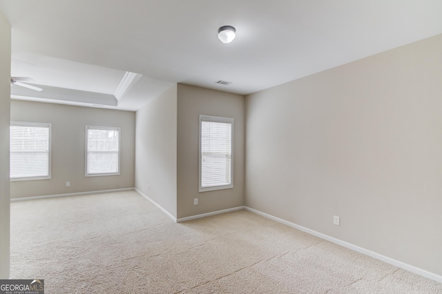 2275 W Village Ln SE, Smyrna, GA 30080 - spare room with carpet floors, visible vents, baseboards, ceiling fan, and plenty of natural light