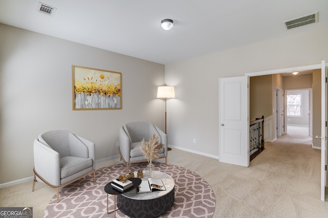 2275 W Village Ln SE, Smyrna, GA 30080 - living area featuring visible vents, an upstairs landing, and light colored carpet