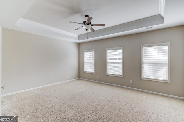 2275 W Village Ln SE, Smyrna, GA 30080 - spare room with ceiling fan, a raised ceiling, baseboards, visible vents, and ornamental molding