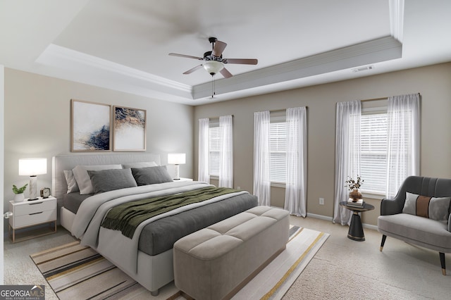 2275 W Village Ln SE, Smyrna, GA 30080 - bedroom featuring light colored carpet, crown molding, visible vents, a raised ceiling, and baseboards