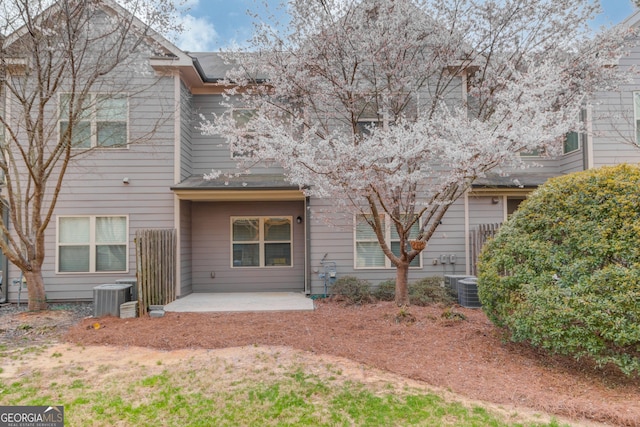 2275 W Village Ln SE, Smyrna, GA 30080 - back of property featuring central AC unit and a patio area