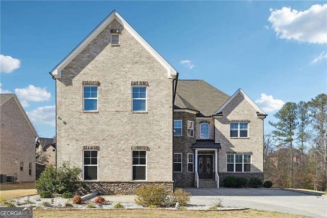 view of front of property featuring brick siding