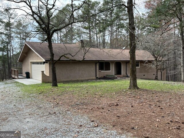 exterior space featuring a garage and driveway