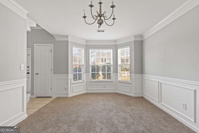 unfurnished dining area with carpet floors, visible vents, and a healthy amount of sunlight