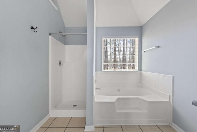 bathroom featuring baseboards, a shower, tile patterned floors, a garden tub, and vaulted ceiling