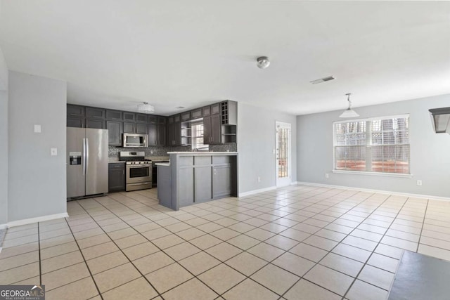 kitchen with stainless steel appliances, light tile patterned flooring, decorative backsplash, and open shelves