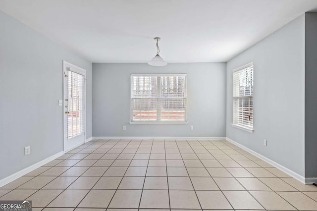 spare room featuring baseboards