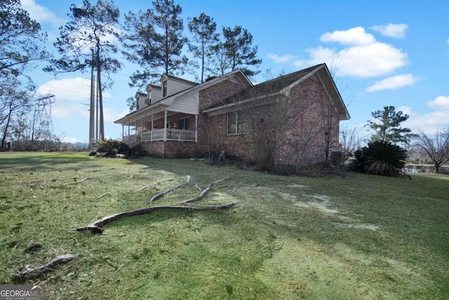 view of property exterior with a lawn and brick siding