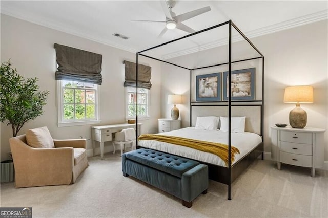 bedroom with carpet, visible vents, crown molding, and ceiling fan