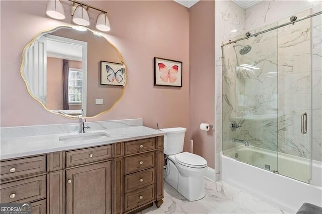 full bathroom featuring toilet, marble finish floor, enclosed tub / shower combo, and vanity