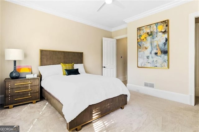 carpeted bedroom with ceiling fan, ornamental molding, visible vents, and baseboards