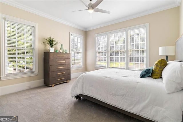 bedroom featuring carpet floors, multiple windows, and crown molding