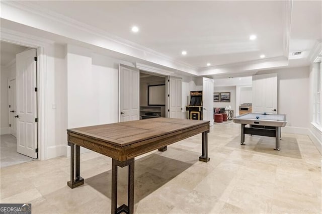 game room with ornamental molding, a tray ceiling, baseboards, and recessed lighting