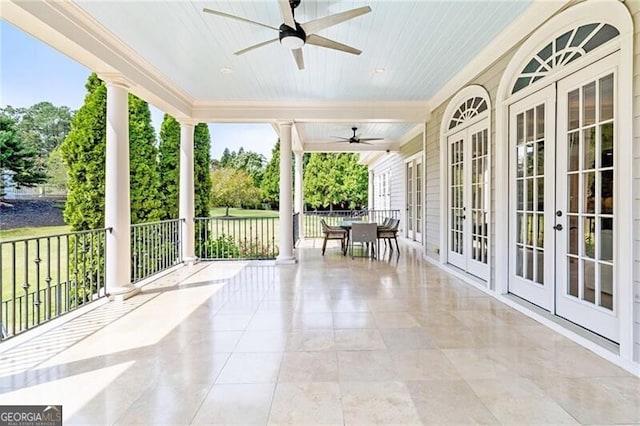 view of patio with outdoor dining space, ceiling fan, and french doors