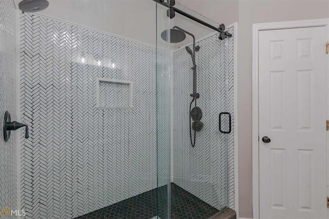 full bath with a shower stall