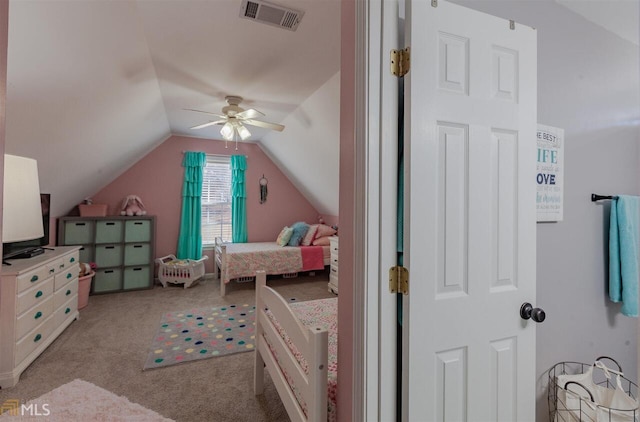 bedroom with light colored carpet, visible vents, ceiling fan, and lofted ceiling