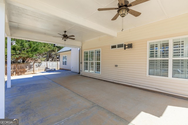 view of patio / terrace featuring ceiling fan and fence