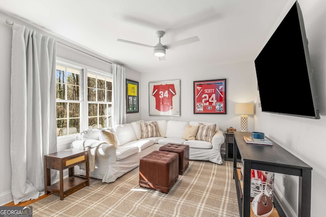 living area featuring ceiling fan