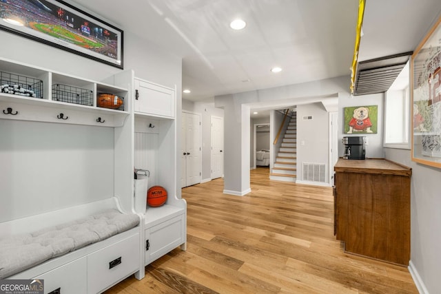 mudroom with recessed lighting, baseboards, visible vents, and light wood finished floors