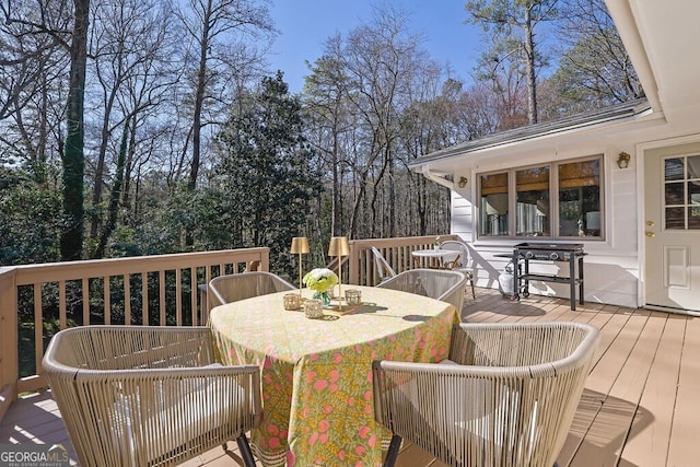 deck featuring outdoor dining area