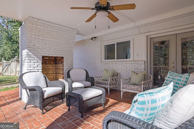 view of patio with ceiling fan, fence, and an outdoor hangout area