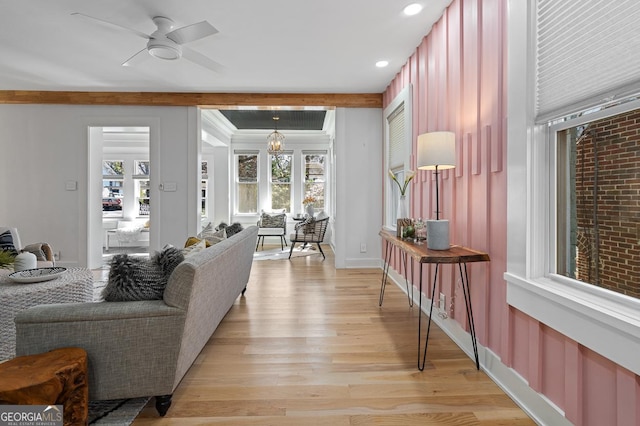 living area featuring ceiling fan with notable chandelier, light wood-type flooring, and recessed lighting