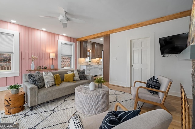 living area with light wood finished floors, ceiling fan, and recessed lighting