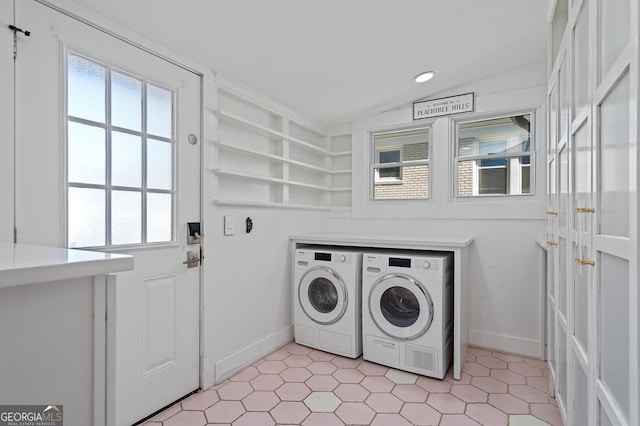 laundry area with light floors, laundry area, independent washer and dryer, and baseboards