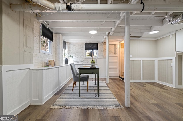 dining space with wood finished floors