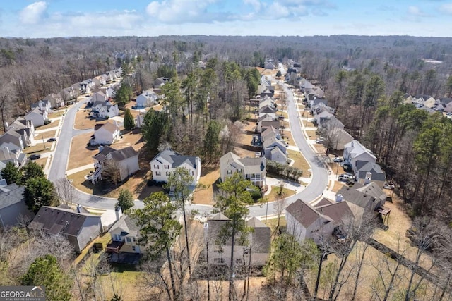 aerial view with a residential view and a view of trees