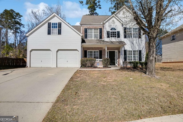 view of front of home with an attached garage, brick siding, fence, concrete driveway, and a front yard