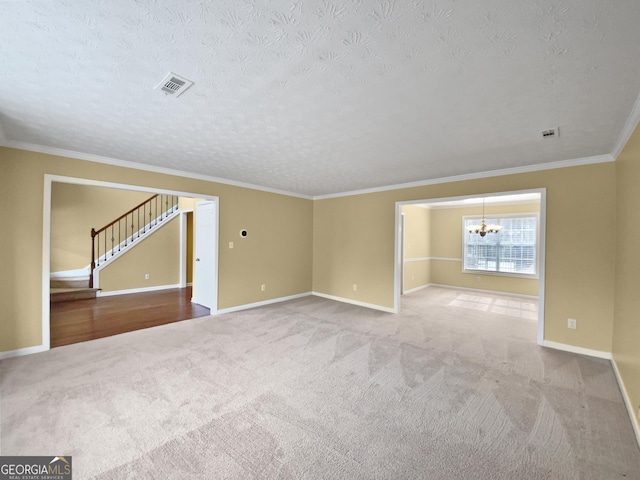 unfurnished room featuring stairway, carpet, visible vents, and a notable chandelier