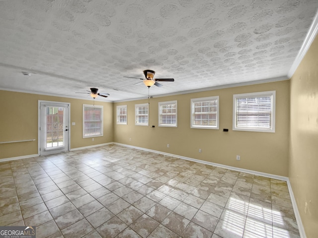 spare room featuring light tile patterned floors, ornamental molding, a ceiling fan, a textured ceiling, and baseboards