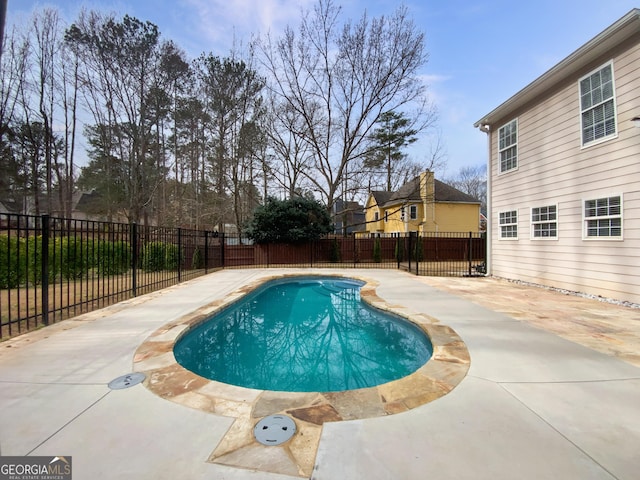 view of pool with a fenced in pool, a fenced backyard, and a patio