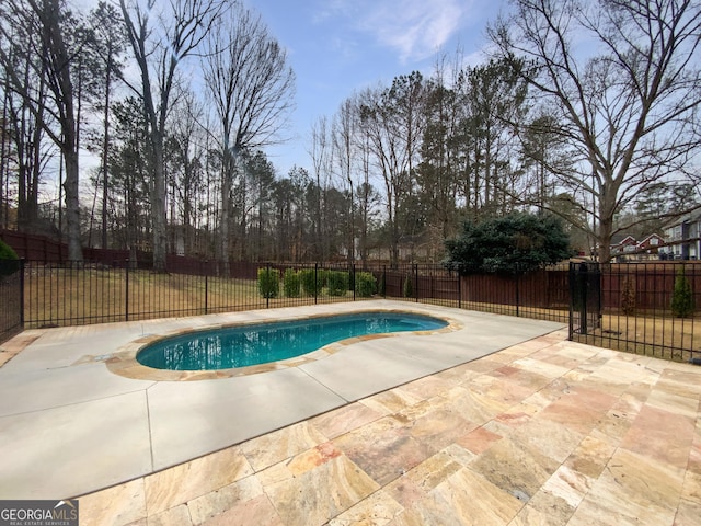 view of pool with a fenced in pool, a patio area, and a fenced backyard