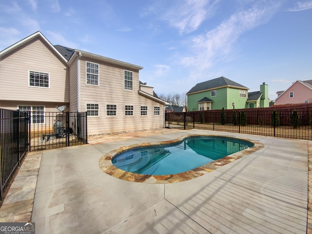 view of pool with a patio, a fenced backyard, and a fenced in pool