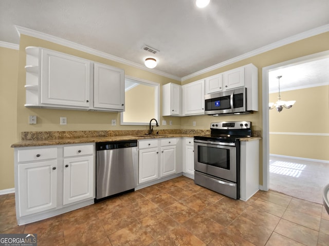 kitchen featuring visible vents, white cabinets, appliances with stainless steel finishes, a chandelier, and a sink