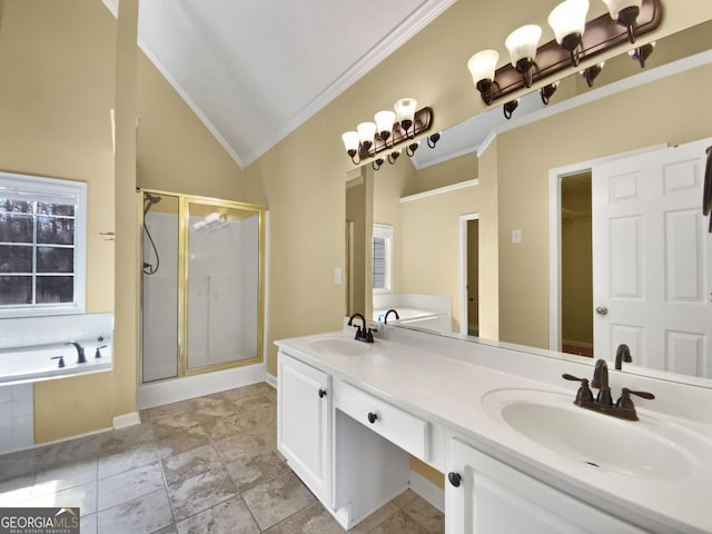 bathroom with a bath, a shower stall, vaulted ceiling, and a sink