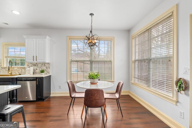 dining area featuring a notable chandelier, baseboards, dark wood-style flooring, and recessed lighting