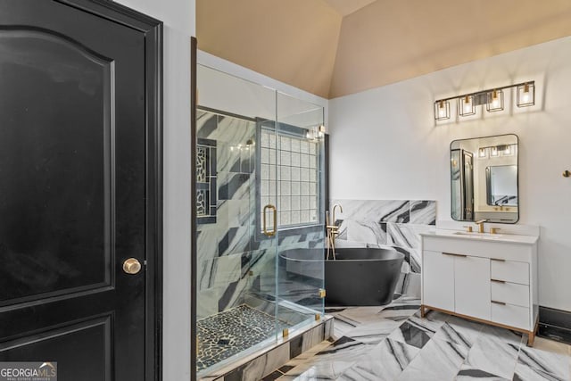 bathroom featuring a stall shower, a freestanding bath, and vanity