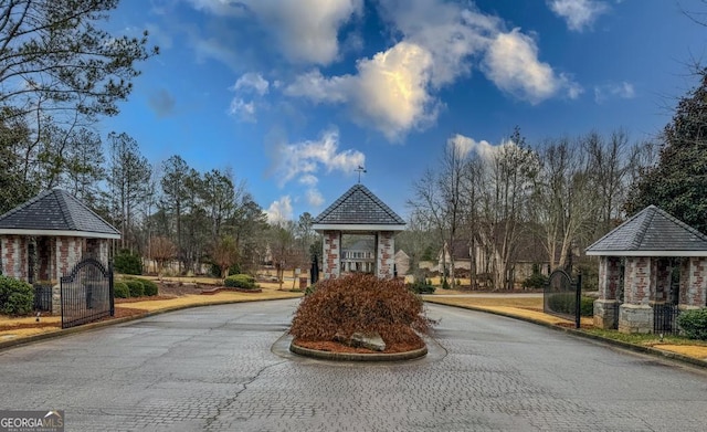 surrounding community featuring curved driveway