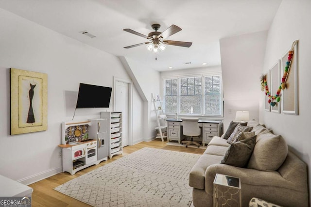 living area with baseboards, visible vents, a ceiling fan, light wood-style floors, and recessed lighting