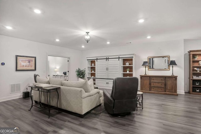 living area with baseboards, dark wood finished floors, visible vents, and recessed lighting